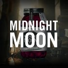 A glass jar of raspberry moonshine, illuminated in dark surroundings, with the words "MIDNIGHT MOON".