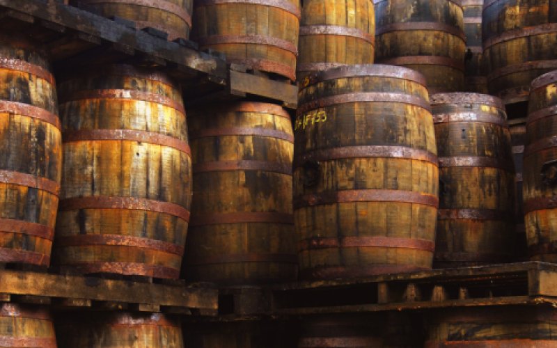 Several old barrels in a storage room